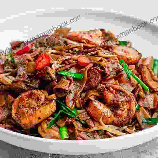 A Piping Hot Plate Of Char Kway Teow, Featuring Stir Fried Flat Noodles Tossed In A Symphony Of Sauces And Ingredients, Exuding An Enticing Smoky Aroma. Flavors Of The Southeast Asian Grill: Classic Recipes For Seafood And Meats Cooked Over Charcoal A Cookbook