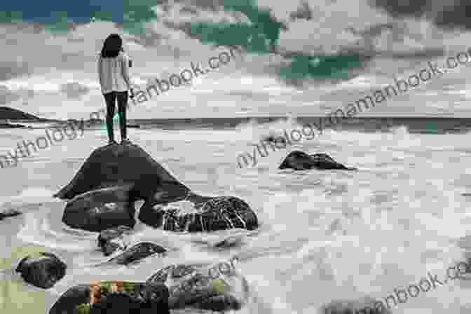 A Woman Stands On A Beach, Looking Out At The Stormy Sea. Sad Wind From The Sea